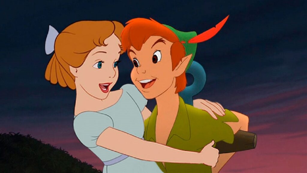 Imangen de un niño pelirojo vestido de verde llamado peter pan y una niña rubia vestida de azul con un moño del mismo color llada wendy para ejemplicar el sindrome de peter pan